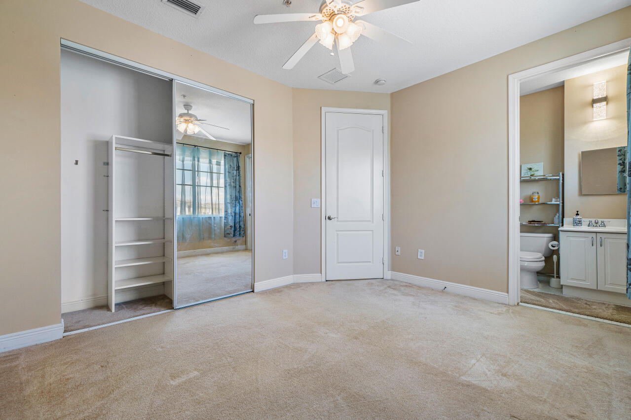 669 Northwest 38th Circle Boca Raton, FL 33431 - Photo 22 of 35 an empty room with fan and entrance