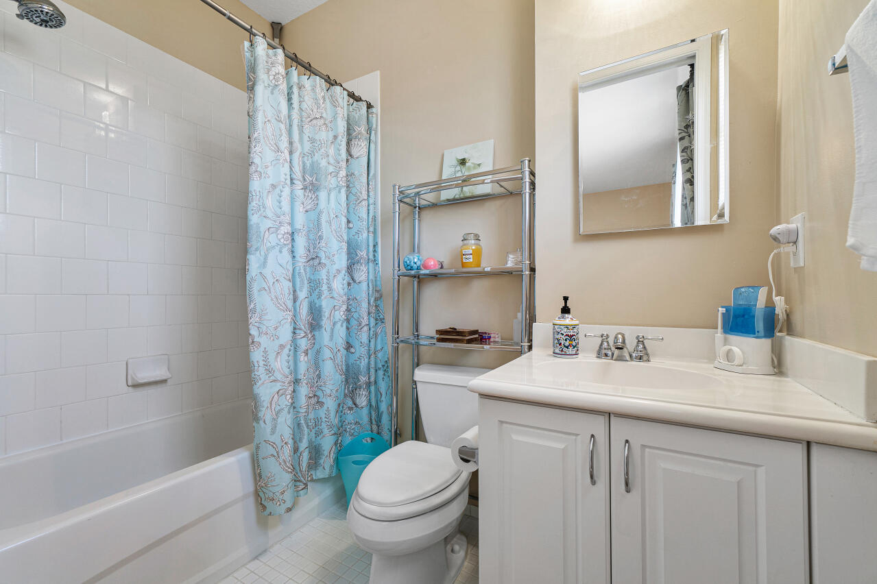 669 Northwest 38th Circle Boca Raton, FL 33431 - Photo 23 of 35 a bathroom with a sink toilet and shower