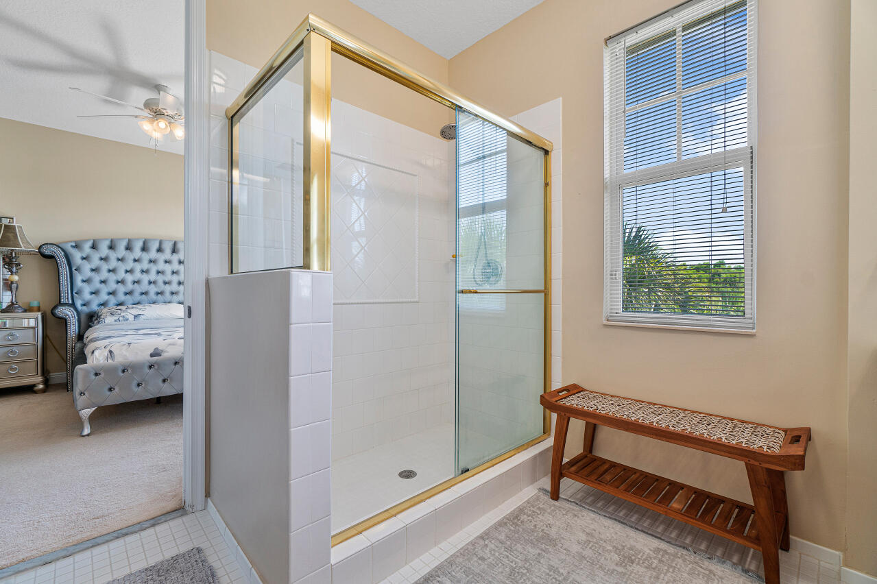 669 Northwest 38th Circle Boca Raton, FL 33431 - Photo 24 of 35 a bedroom with a bed and a window
