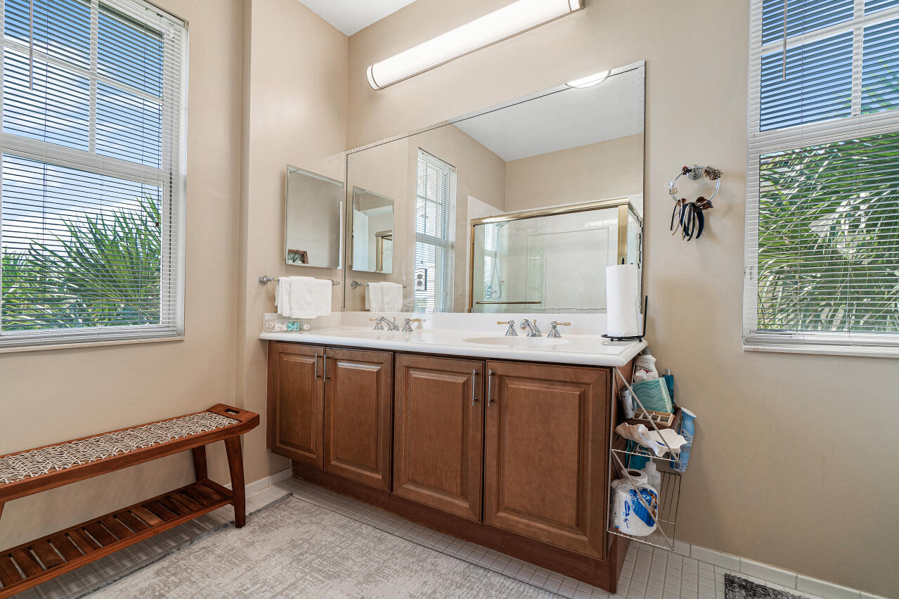 669 Northwest 38th Circle Boca Raton, FL 33431 - Photo 25 of 35 a bathroom with a double vanity sink and a mirror