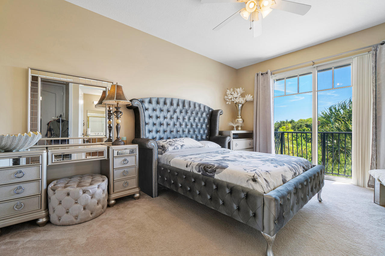 669 Northwest 38th Circle Boca Raton, FL 33431 - Photo 27 of 35 a bedroom with a bed table and window
