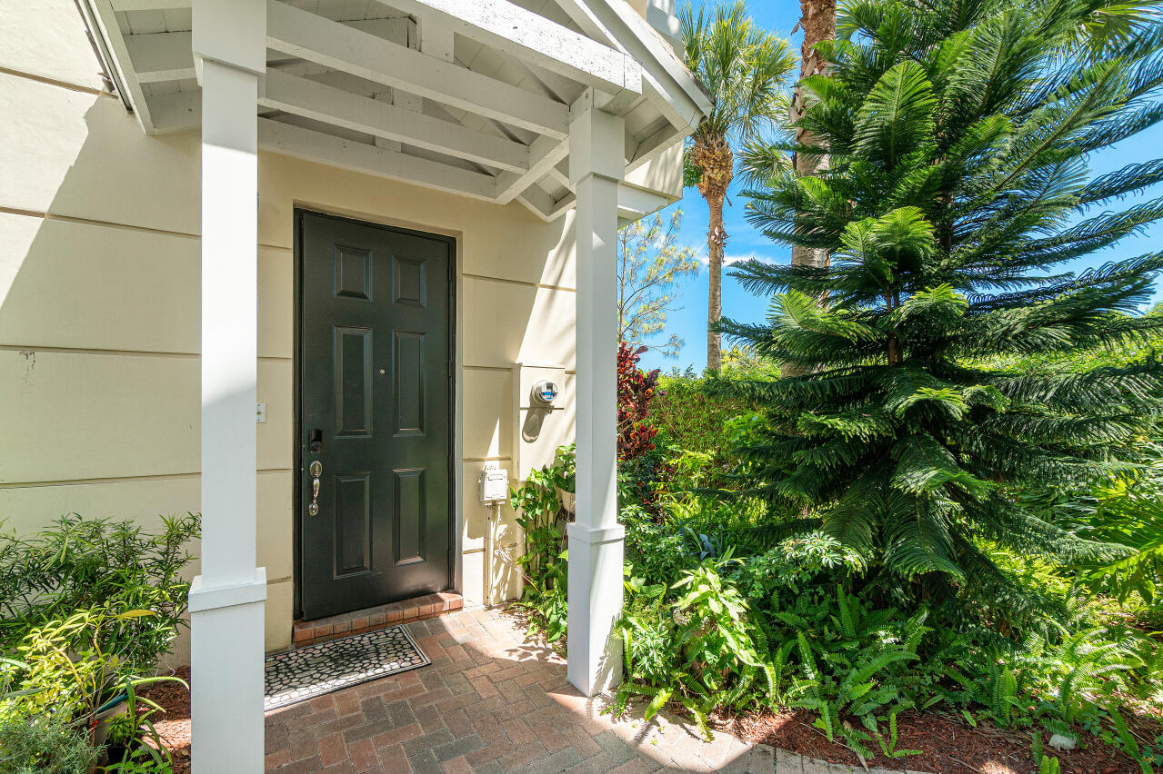 669 Northwest 38th Circle Boca Raton, FL 33431 - Photo 3 of 35 a couple of potted plants in front of door