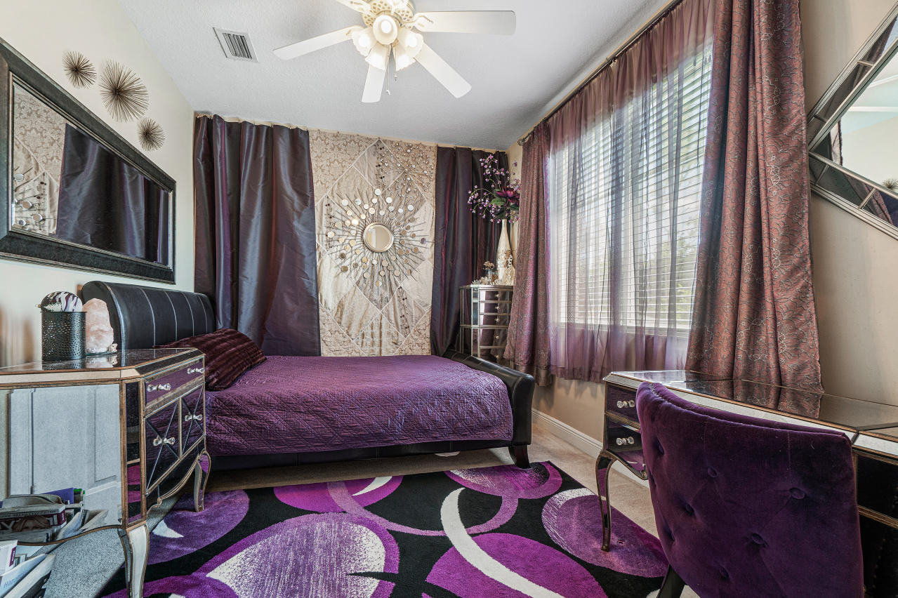 669 Northwest 38th Circle Boca Raton, FL 33431 - Photo 5 of 35 a bedroom with a bed dresser and a window