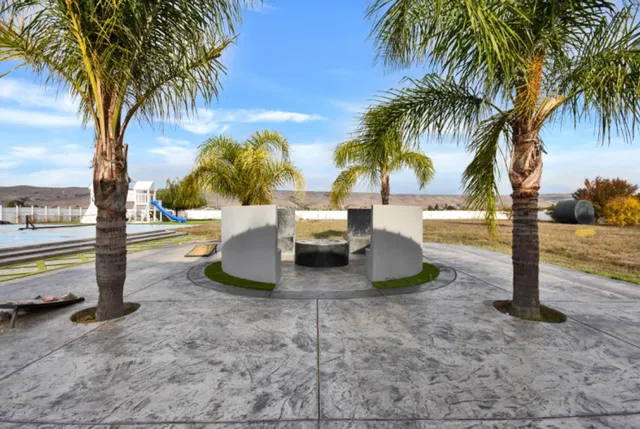 a view of a swimming pool with a lawn chairs