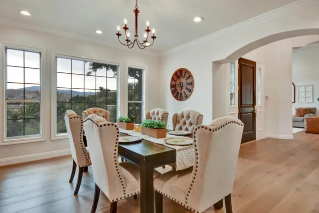 a view of a dining room with furniture window and wooden floor