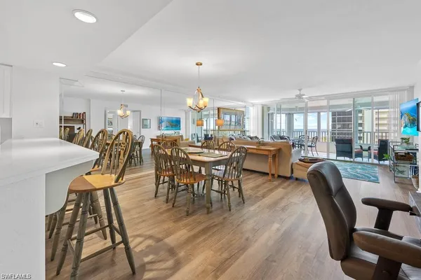 a kitchen with stainless steel appliances a refrigerator and a table