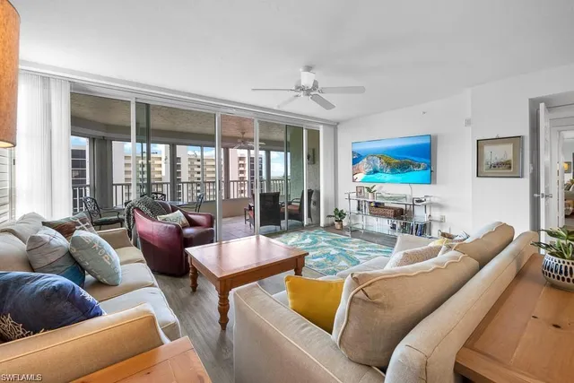 a living room with furniture fireplace and flat screen tv