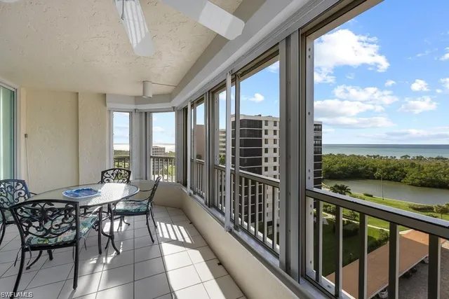 a view of a balcony with chairs