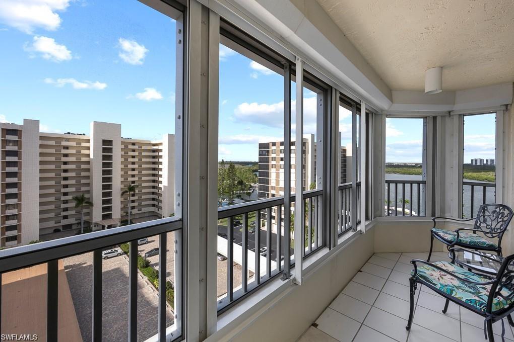 21 Bluebill Avenue, Unit B905 Naples, FL 34108 - Photo 33 of 34 a view of a balcony with chairs