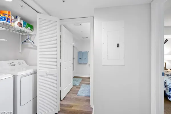 a view of a storage & utility room with a washer dryer