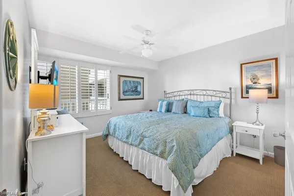 a bedroom with a bed bathroom and window