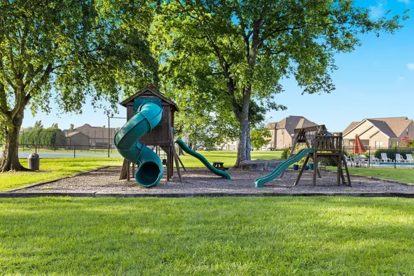 a view of outdoor space playground and green space