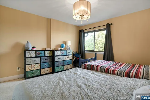 a view of a bedroom with furniture and staircase