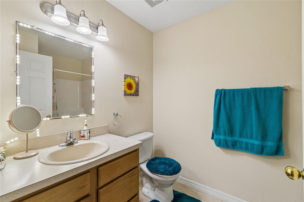 468 North Wheeler Avenue Inverness, FL 34453 - Photo 18 of 24 a bathroom with a sink and a mirror
