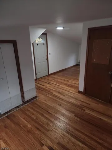 a view of a hallway view with wooden floor