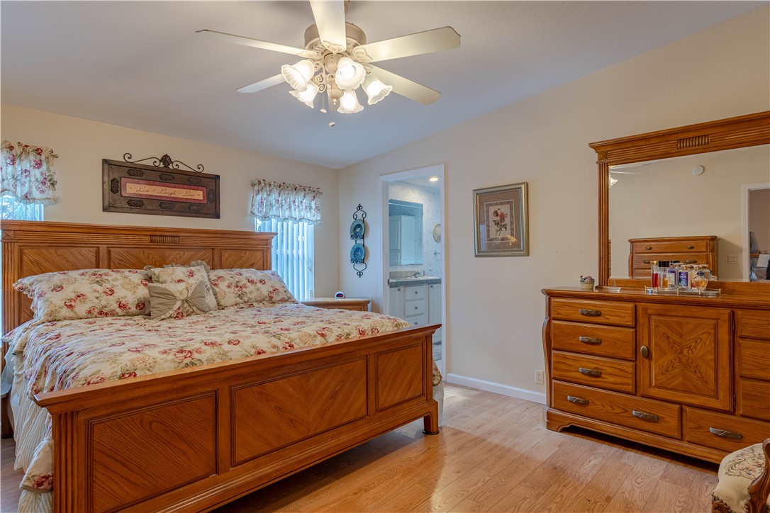 327 Papaya Circle Sebastian, FL 32976 - Photo 12 of 32 a bedroom with a bed and a dresser in it