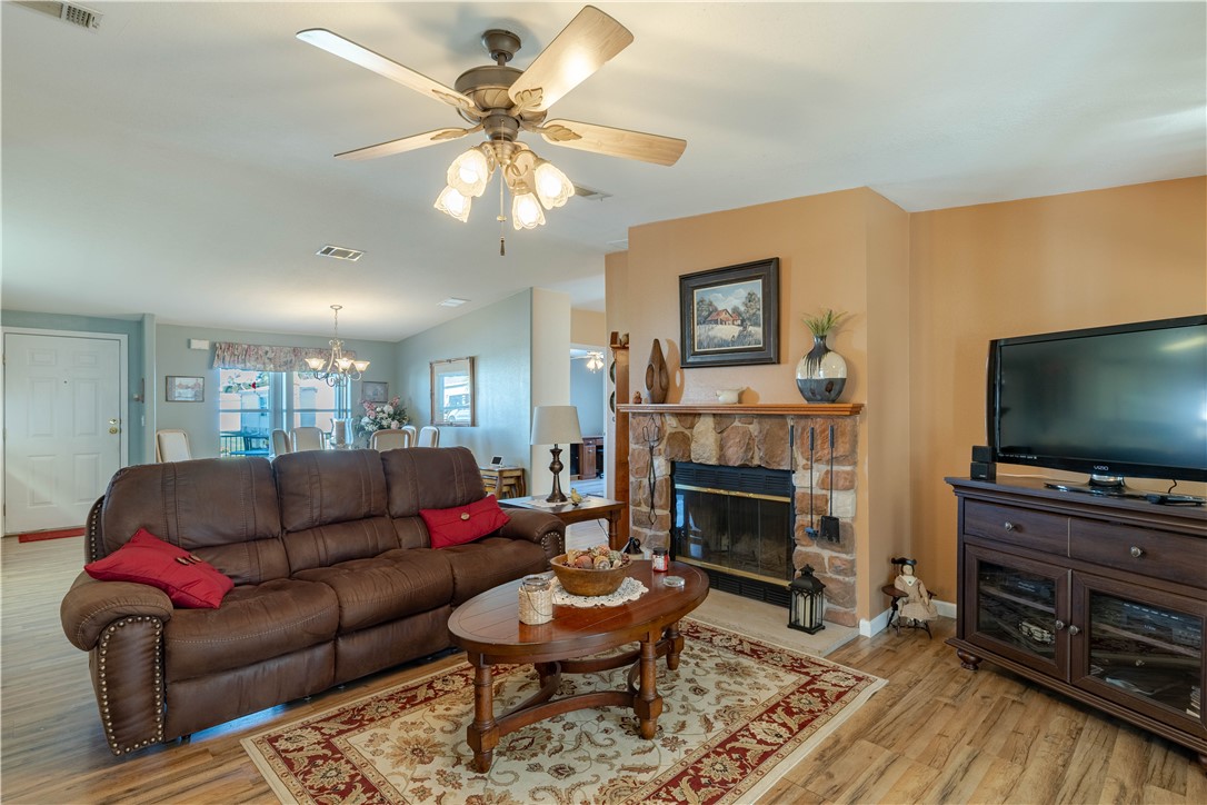 327 Papaya Circle Sebastian, FL 32976 - Photo 15 of 32 a living room with furniture a flat screen tv and a fireplace