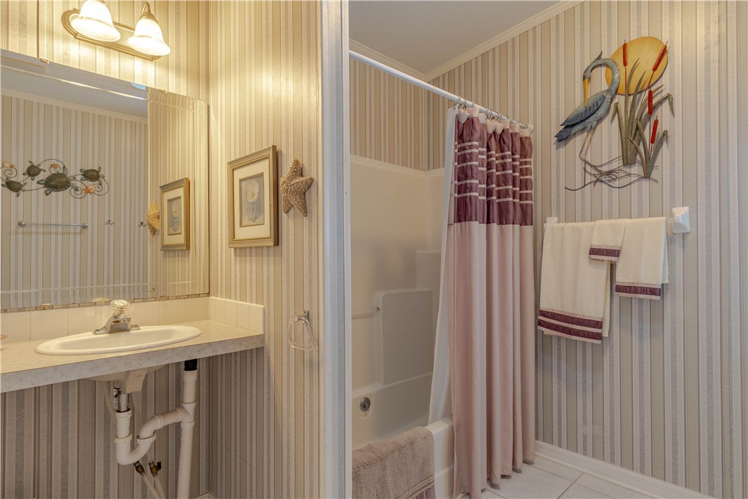 327 Papaya Circle Sebastian, FL 32976 - Photo 20 of 32 a bathroom with a shower and a sink