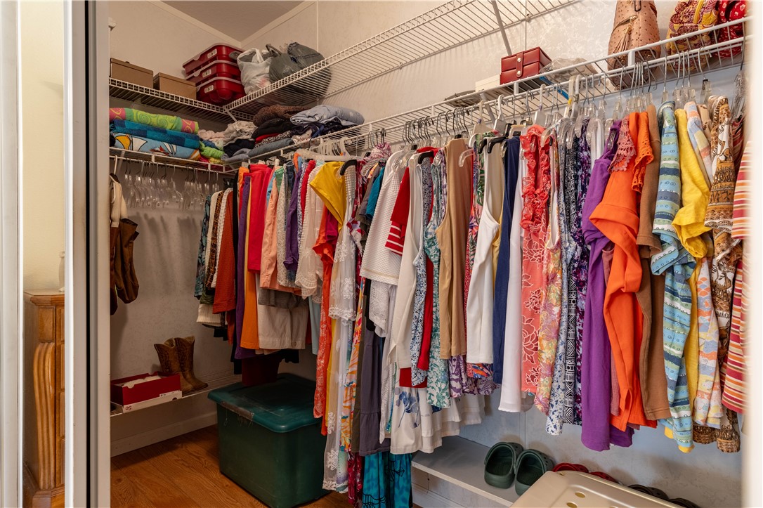 327 Papaya Circle Sebastian, FL 32976 - Photo 21 of 32 a view of walk in closet with clothes and shoes