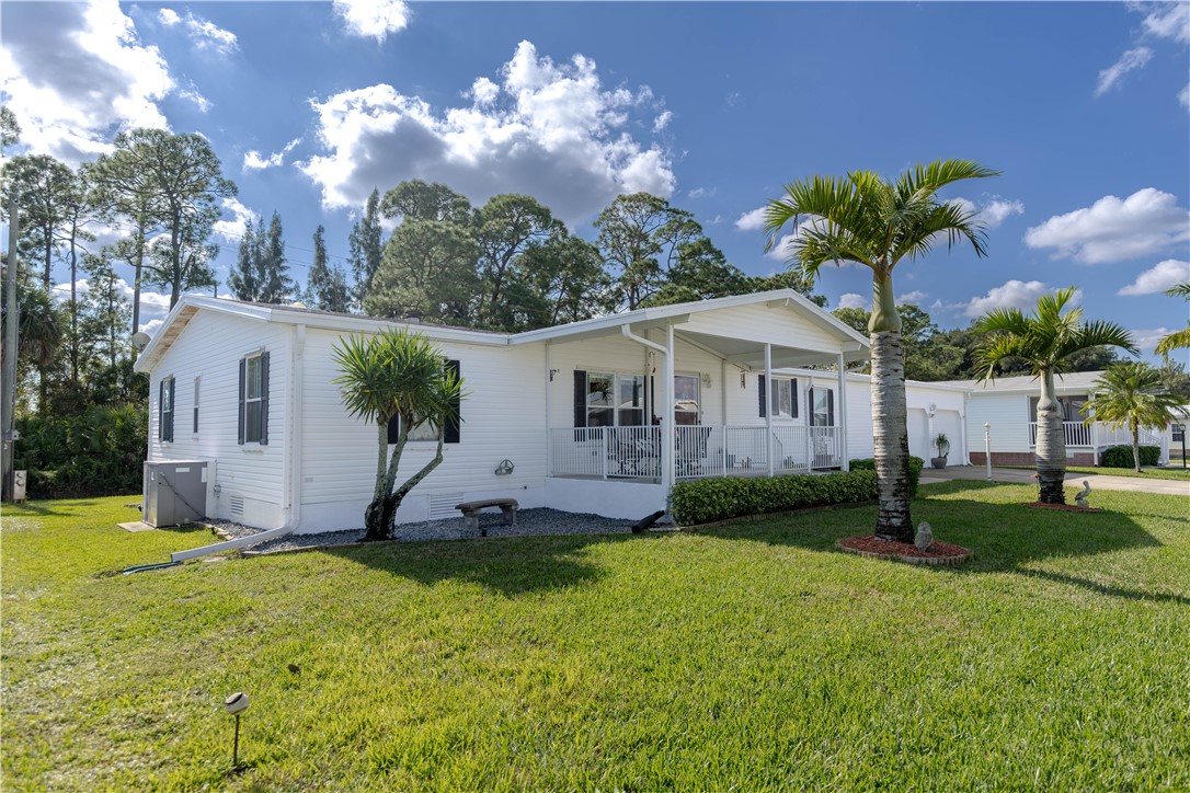 327 Papaya Circle Sebastian, FL 32976 - Photo 27 of 32 a front view of a house with a yard