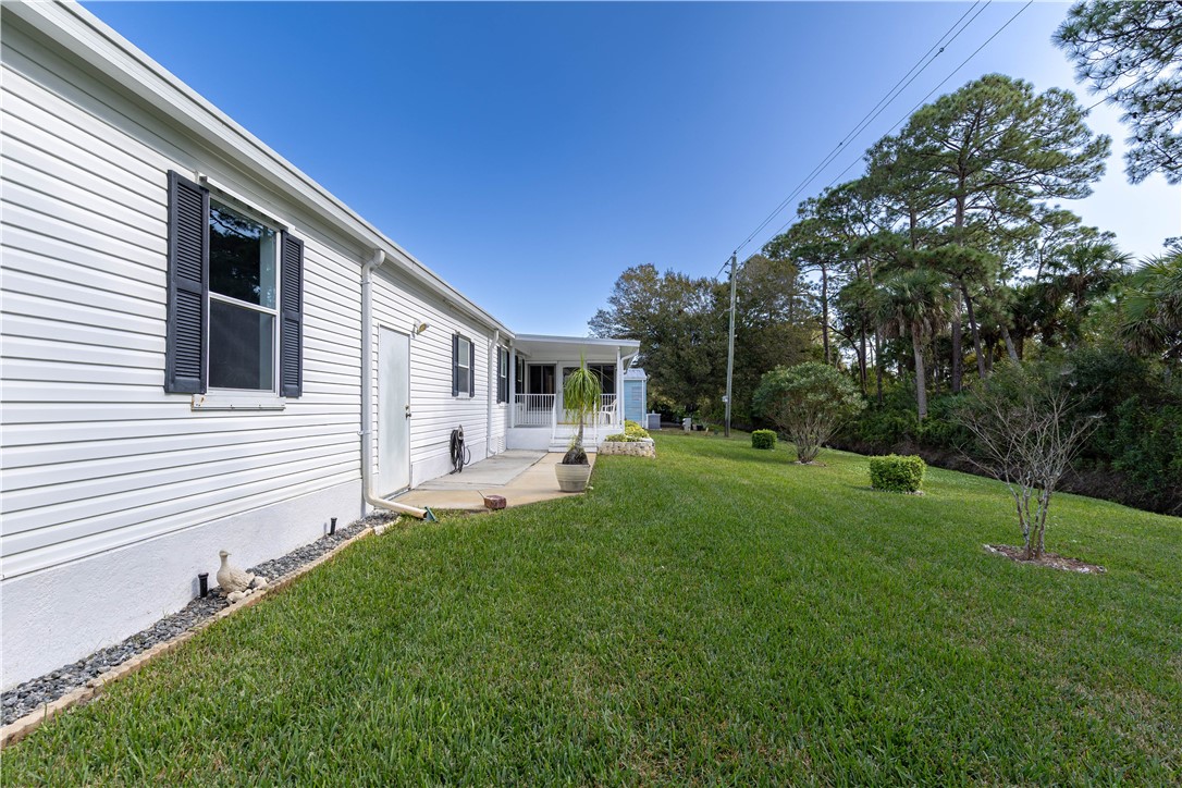 327 Papaya Circle Sebastian, FL 32976 - Photo 28 of 32 a view of house with backyard