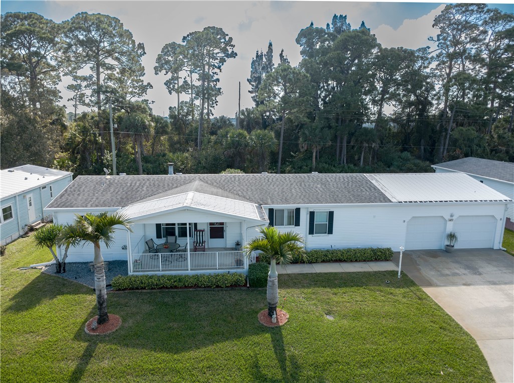 327 Papaya Circle Sebastian, FL 32976 - Photo 29 of 32 a aerial view of a house with garden