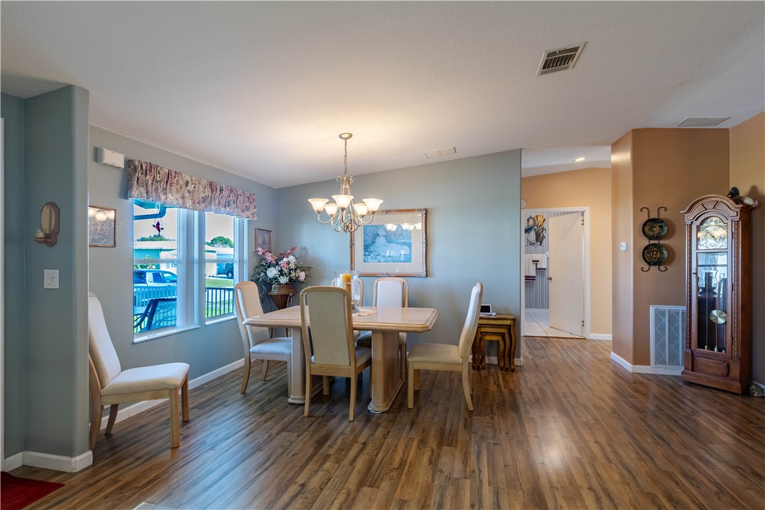 327 Papaya Circle Sebastian, FL 32976 - Photo 5 of 32 a view of a dining room with furniture window and wooden floor