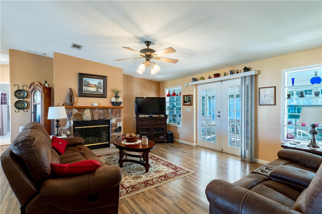 327 Papaya Circle Sebastian, FL 32976 - Photo 6 of 32 a living room with furniture a flat screen tv and a fireplace