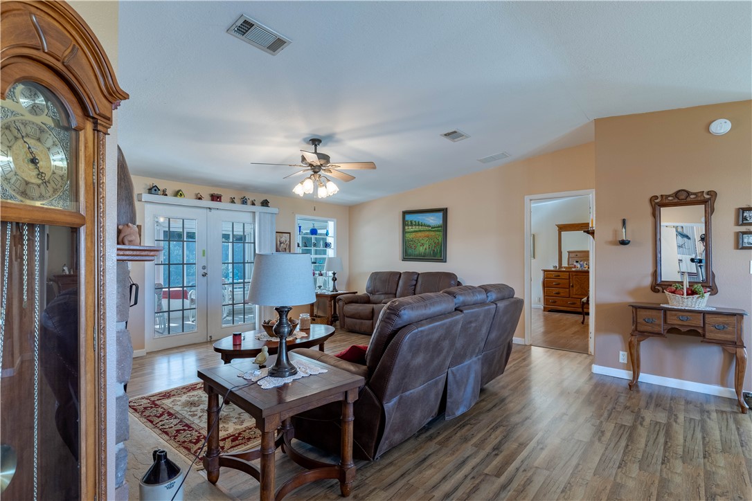 327 Papaya Circle Sebastian, FL 32976 - Photo 9 of 32 a living room with furniture and a chandelier