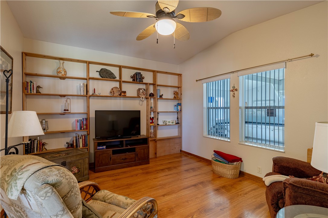 327 Papaya Circle Sebastian, FL 32976 - Photo 10 of 32 a living room with furniture and a flat screen tv