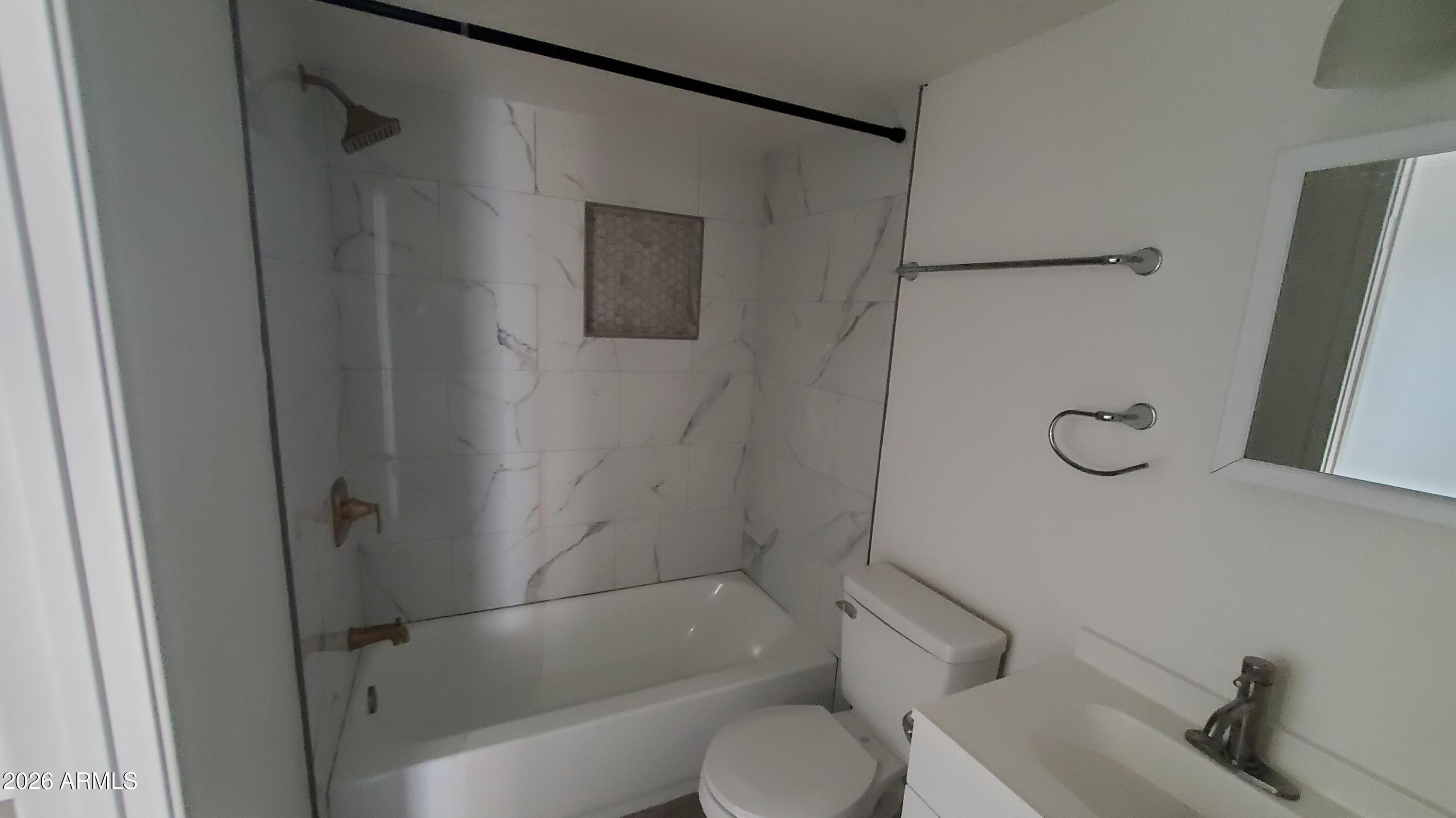 302 South Westfall Avenue, Unit 2 Tempe, AZ 85281 - Photo 14 of 19 a bathroom with a shower and a toilet