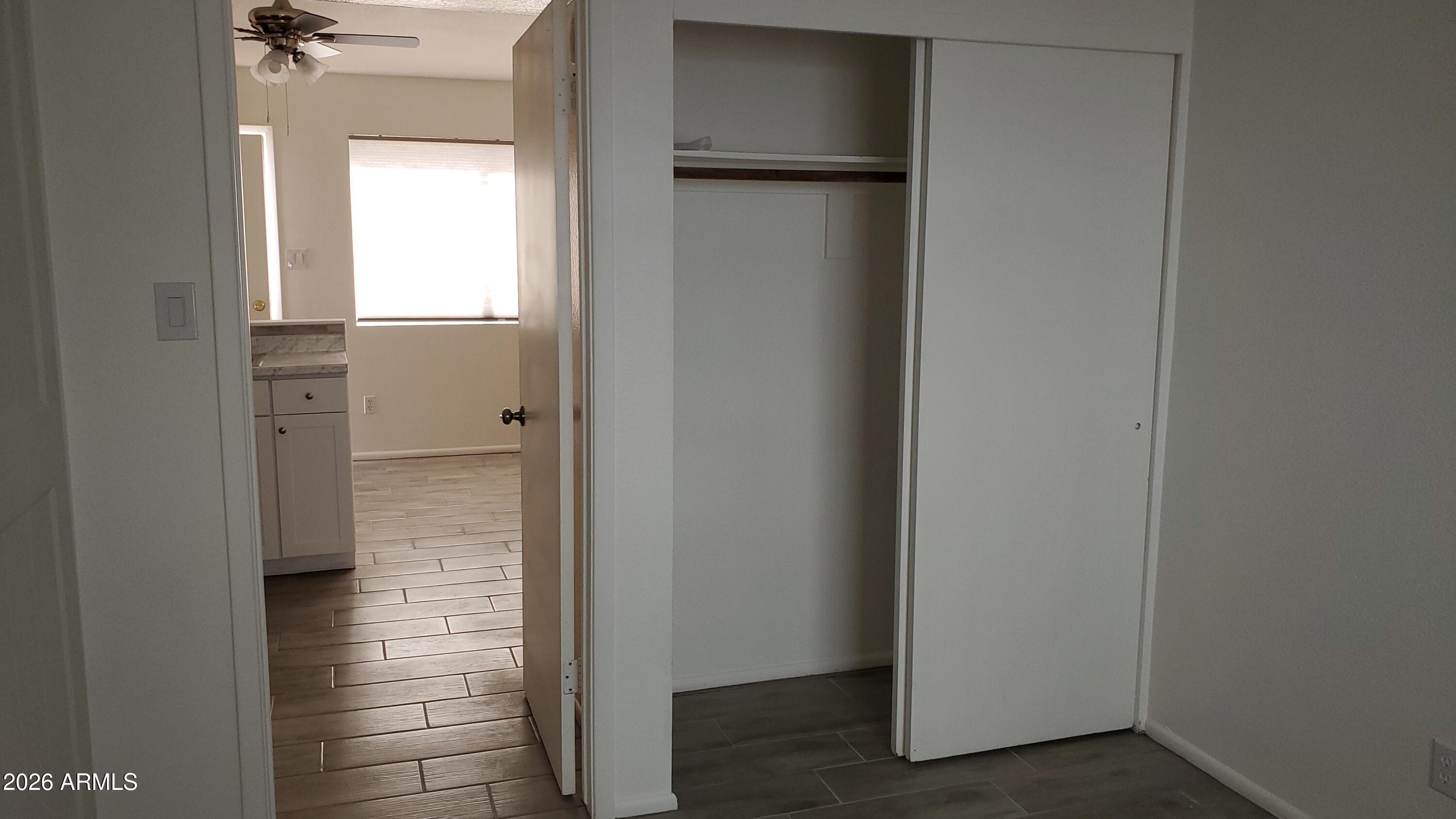 302 South Westfall Avenue, Unit 2 Tempe, AZ 85281 - Photo 17 of 19 an empty room with windows and entrance