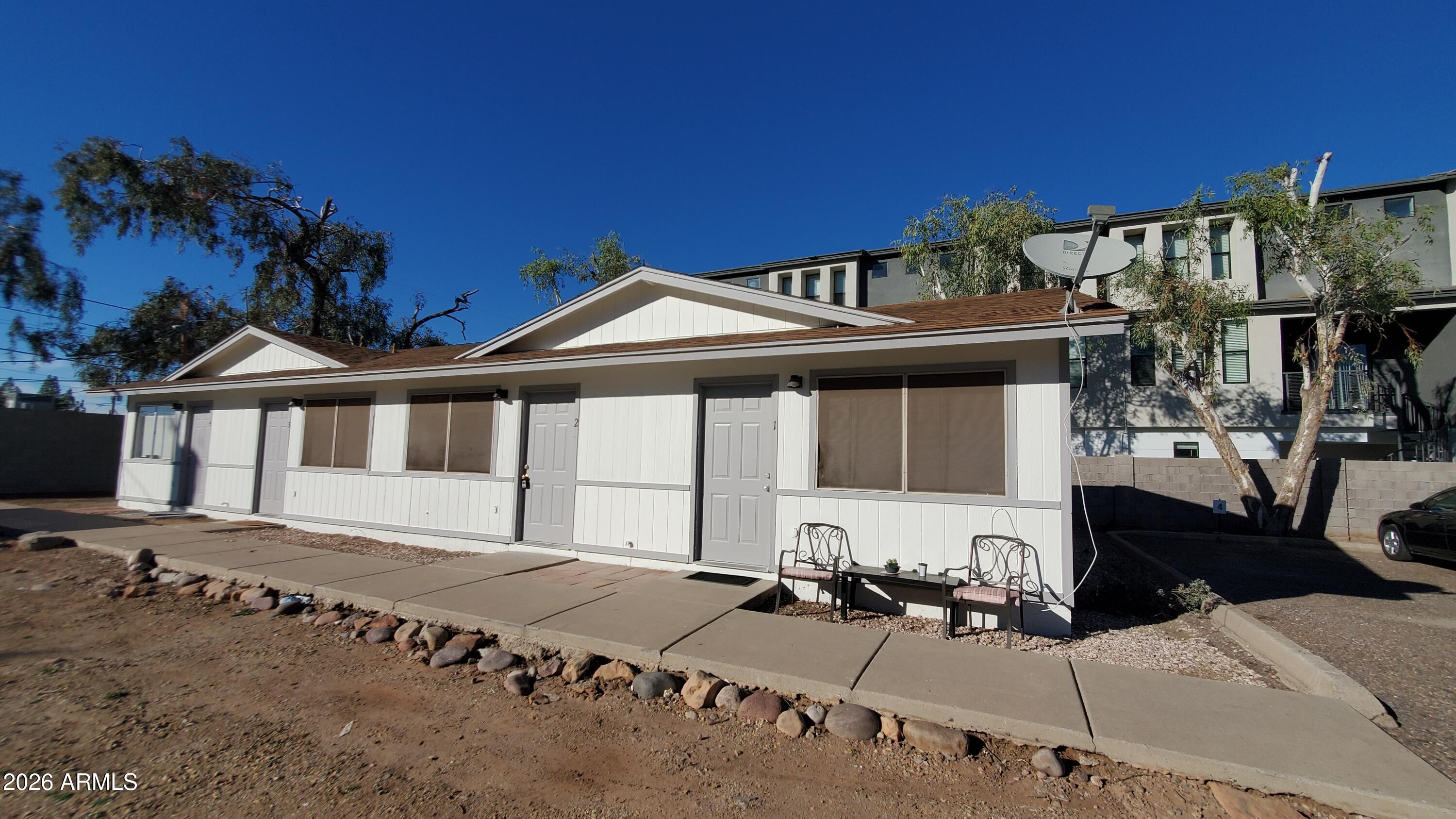 302 South Westfall Avenue, Unit 2 Tempe, AZ 85281 - Photo 19 of 19 a front view of a house with a yard