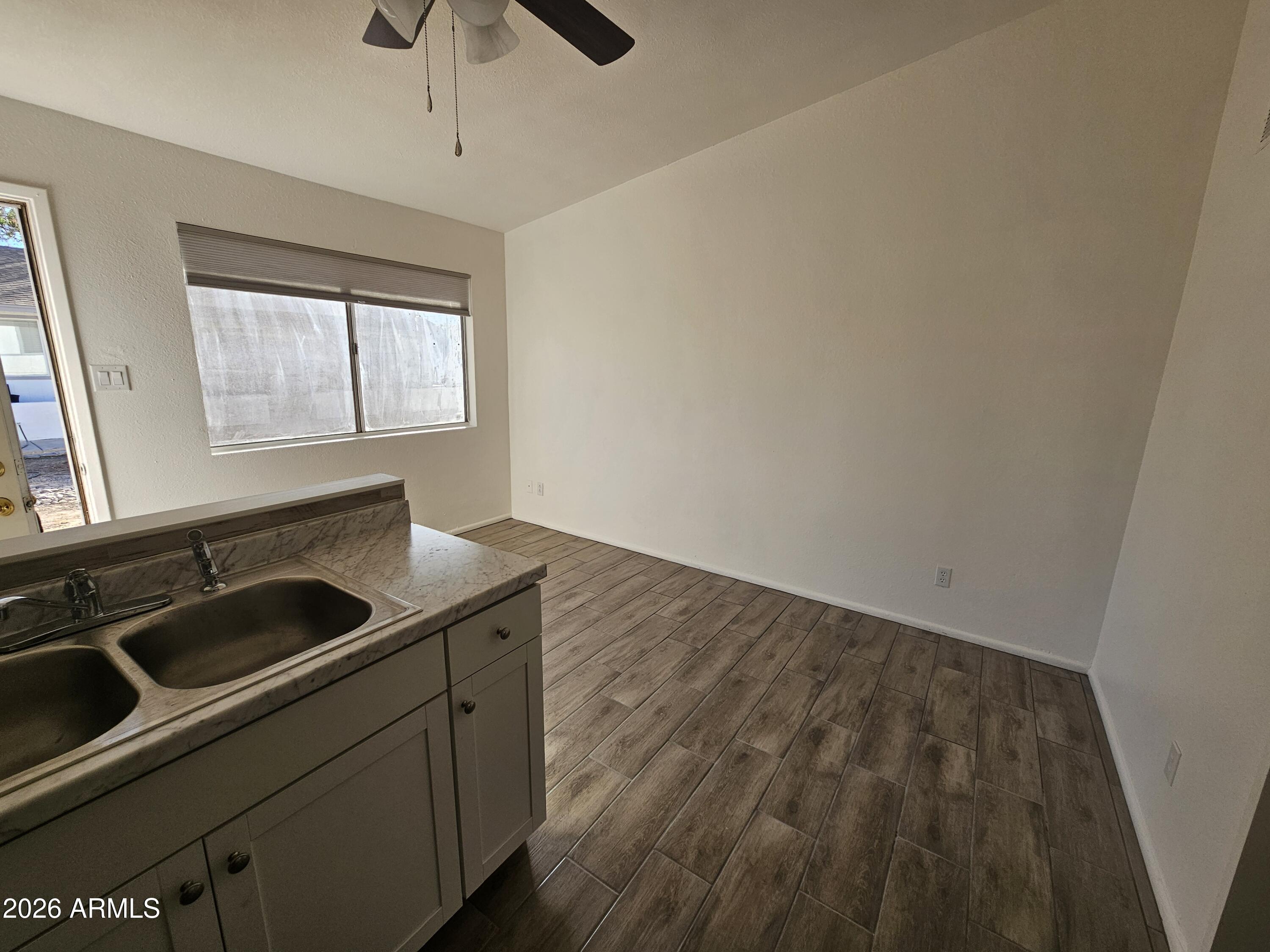 302 South Westfall Avenue, Unit 2 Tempe, AZ 85281 - Photo 5 of 19 a kitchen with a sink and cabinets