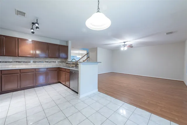 a kitchen with stainless steel appliances a sink and a stove