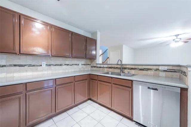 a kitchen with a sink and cabinets