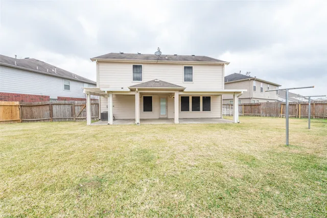 a house view with swimming pool and porch