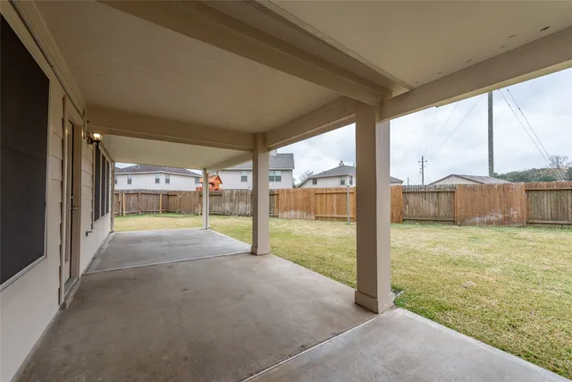 a view of back yard from a room