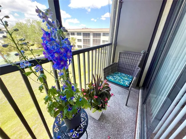 a room with a couch and a bookshelf