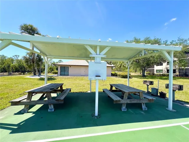 a view of a swimming pool and lounge chairs