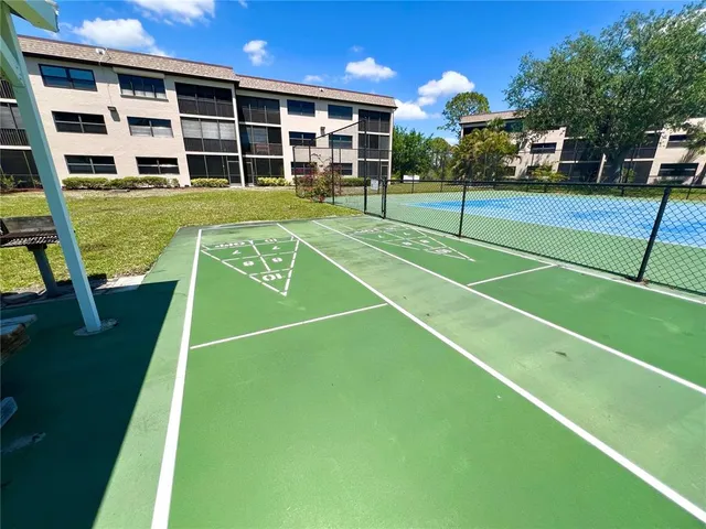 a view of a swimming pool and a yard