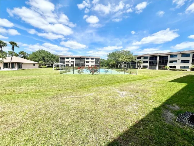 a view of a house with a big yard