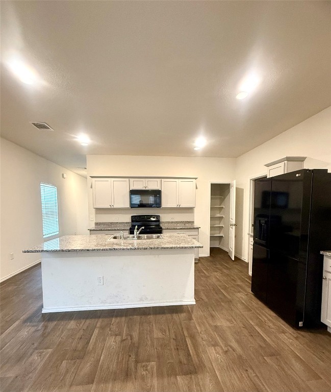 19101 Romano Drive Elgin, TX 78621 - Photo 11 of 36 a kitchen with stainless steel appliances a refrigerator and a sink