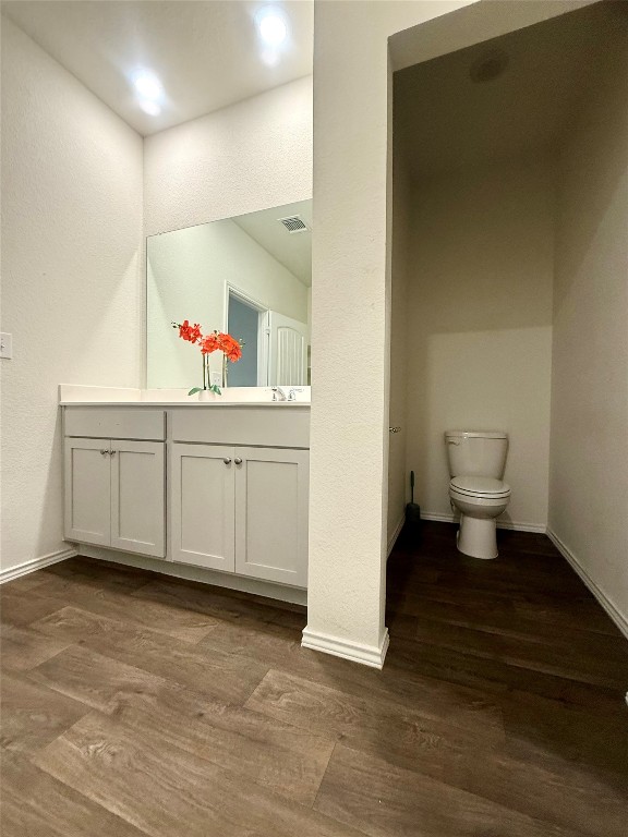 19101 Romano Drive Elgin, TX 78621 - Photo 21 of 36 a kitchen with a sink and a toilet