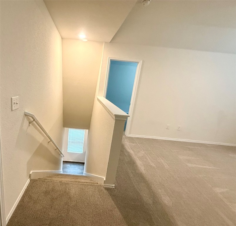 19101 Romano Drive Elgin, TX 78621 - Photo 25 of 36 a view of an empty room with wooden floor