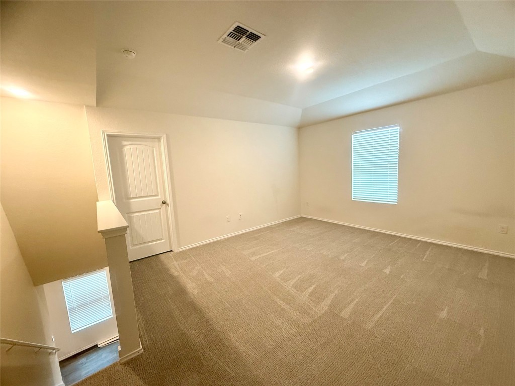 19101 Romano Drive Elgin, TX 78621 - Photo 27 of 36 an empty room with windows