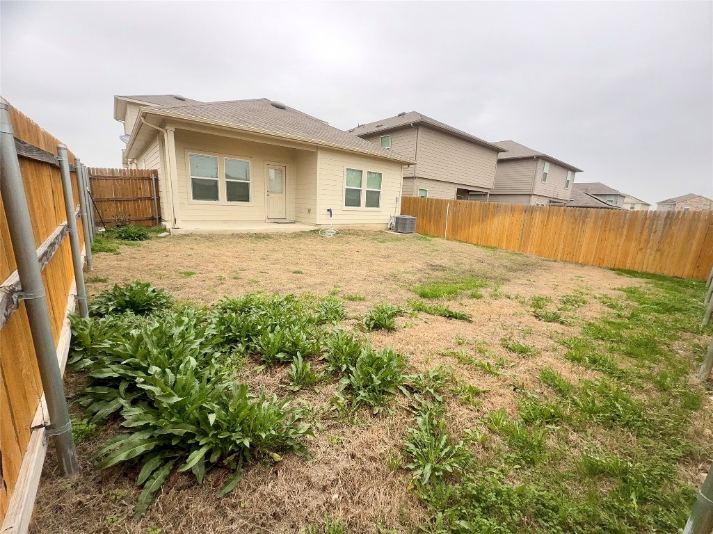 19101 Romano Drive Elgin, TX 78621 - Photo 34 of 36 a view of a house with backyard and garden