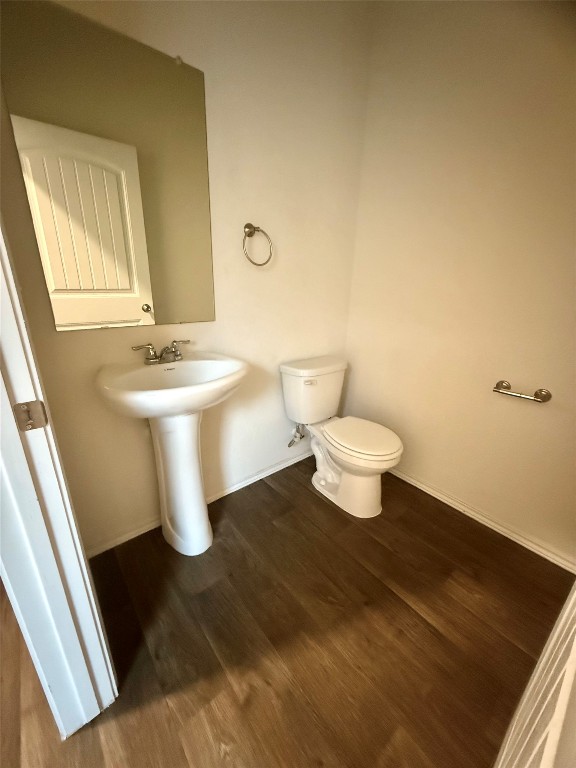 19101 Romano Drive Elgin, TX 78621 - Photo 6 of 36 a bathroom with a toilet and a sink