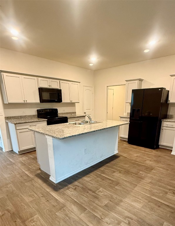 19101 Romano Drive Elgin, TX 78621 - Photo 7 of 36 a kitchen with stainless steel appliances a refrigerator and a microwave