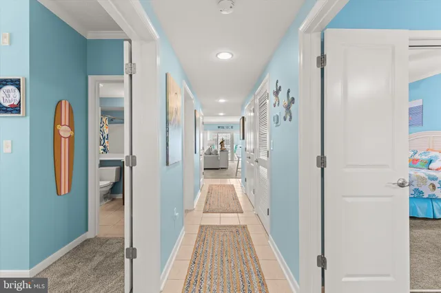 a kitchen with stainless steel appliances granite countertop a refrigerator a stove a sink a stove a dining table and chairs